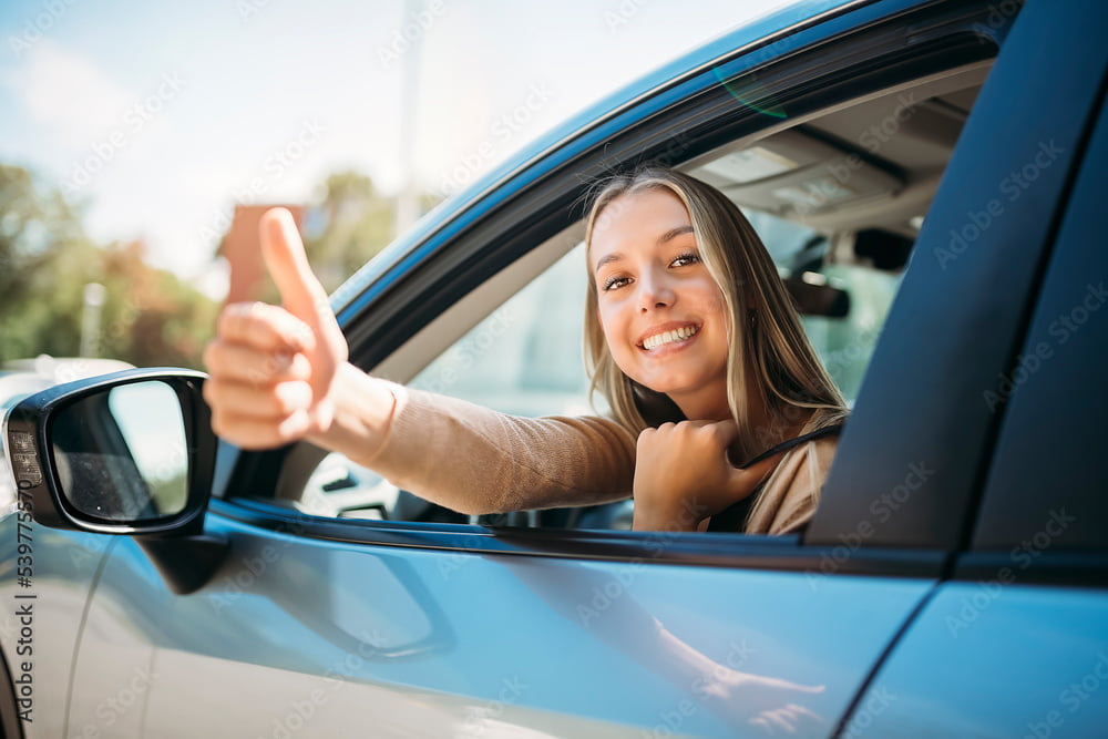 A girl giving a thumbs up.