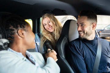 People sharing transportation. Riding in a car.